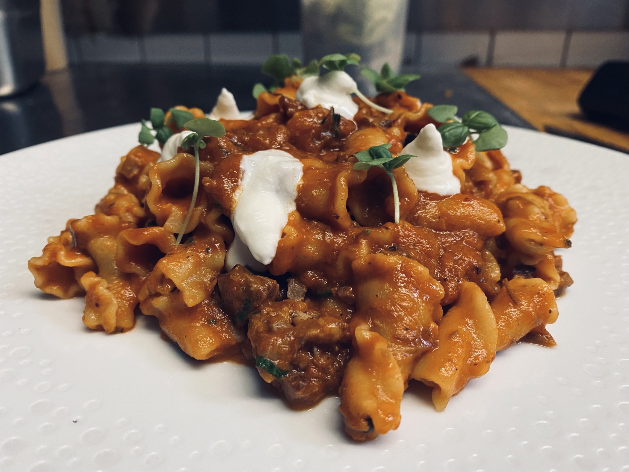 Beef bolognese with burrata prepared for in-home dining in New York