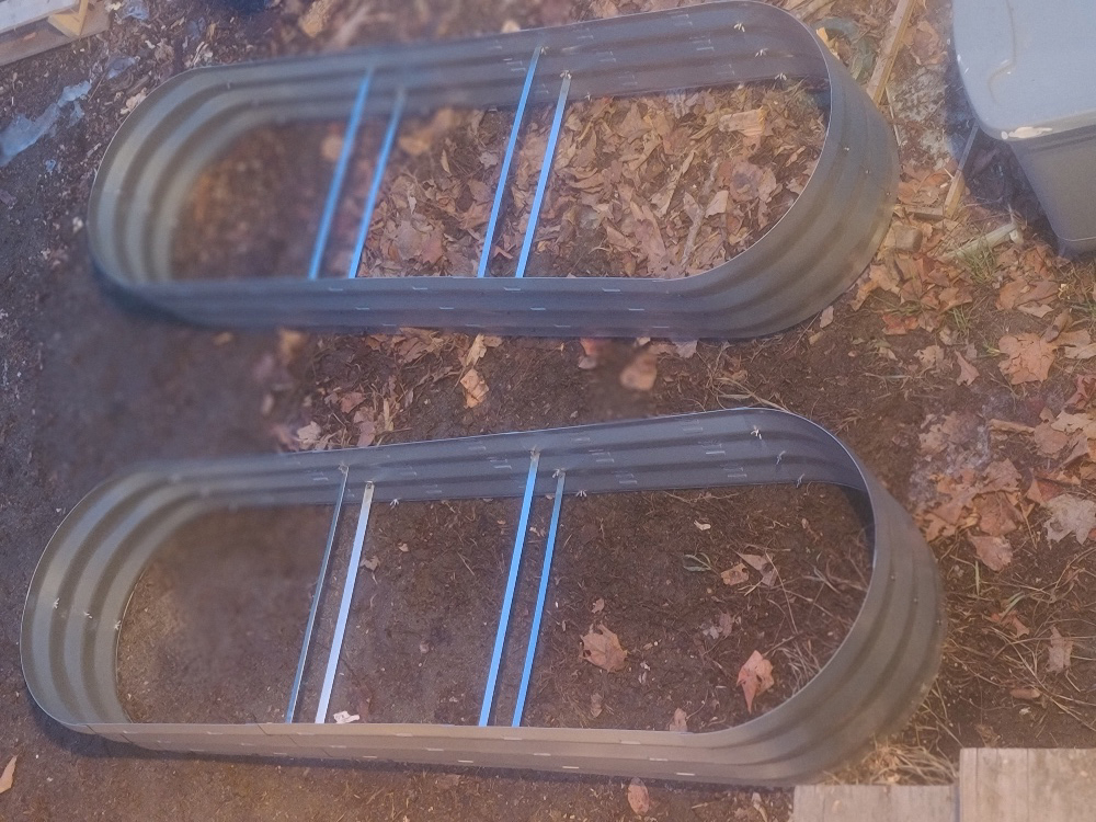 New raised garden beds ready for planting at Saving the Honeybees pollinator garden in Pittsfield Maine