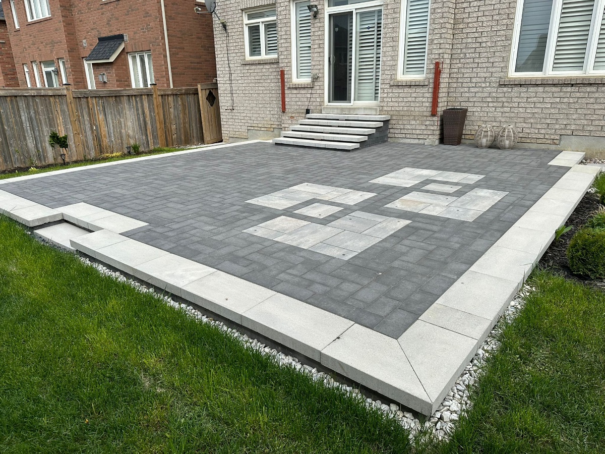 Interlocking stone driveway with decorative border in Calgary