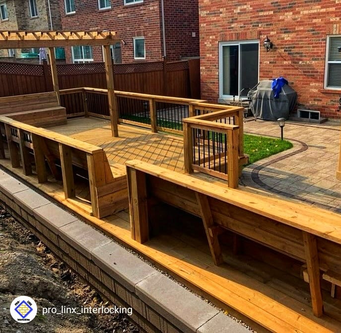 Elevated wooden deck in Calgary with professional railings
