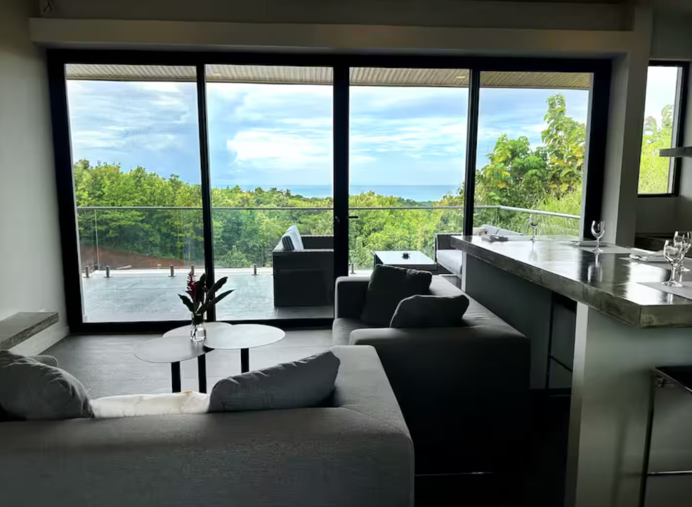 Horizon Suite — open-plan living area with panoramic ocean view