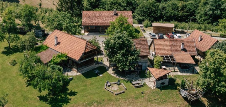 Aerial view of the retreat property surrounded by lush green forest
