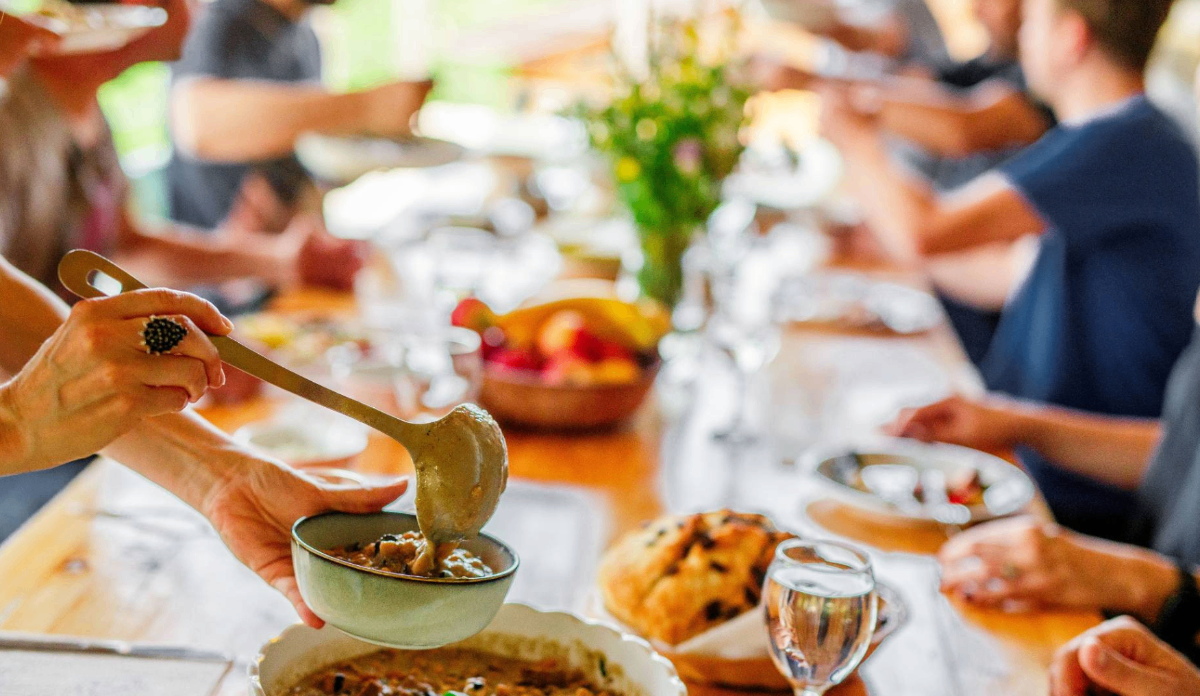 Guests sharing a wholesome communal meal together at the retreat