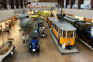 Tesla Museum interior with vintage vehicles and exhibits