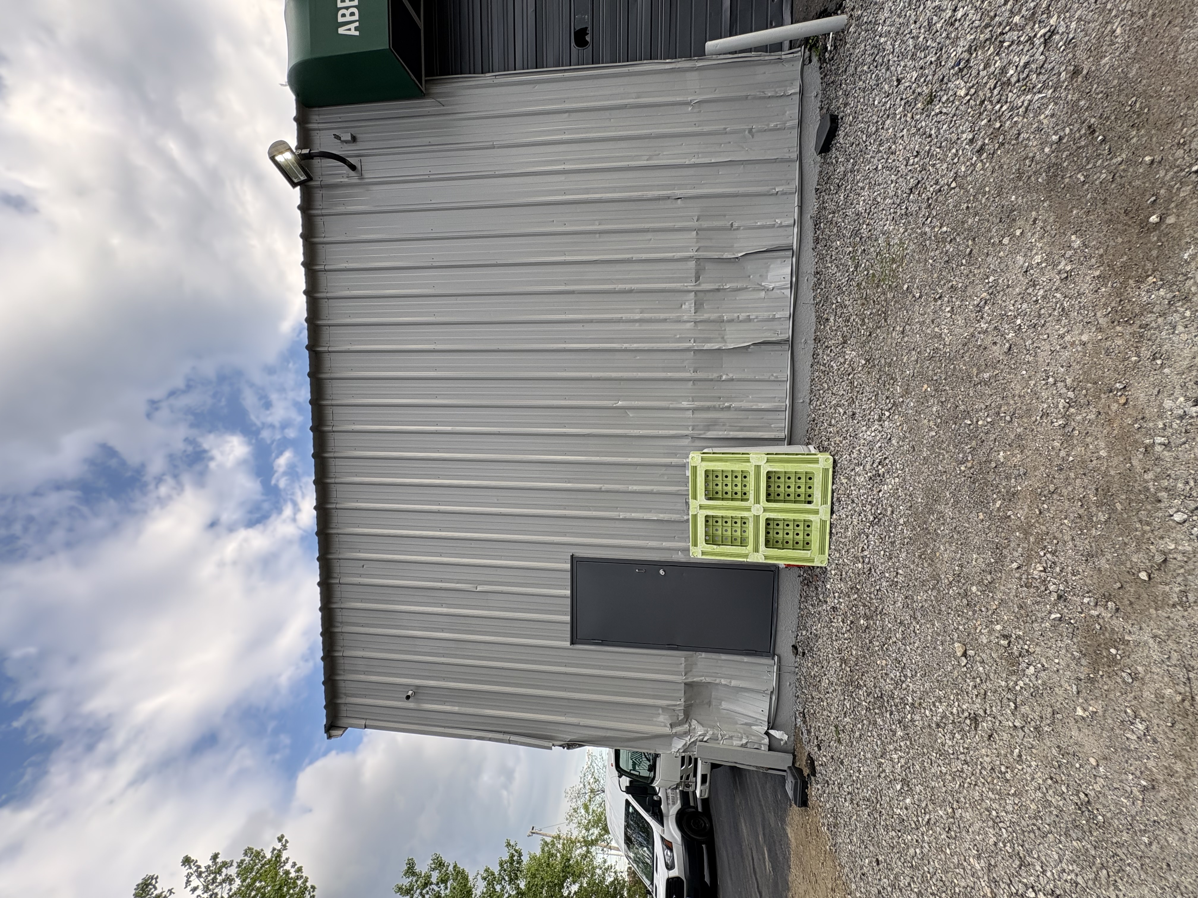 Commercial warehouse exterior painting with weather-resistant coating in New Haven, CT — Almeida Painting CT