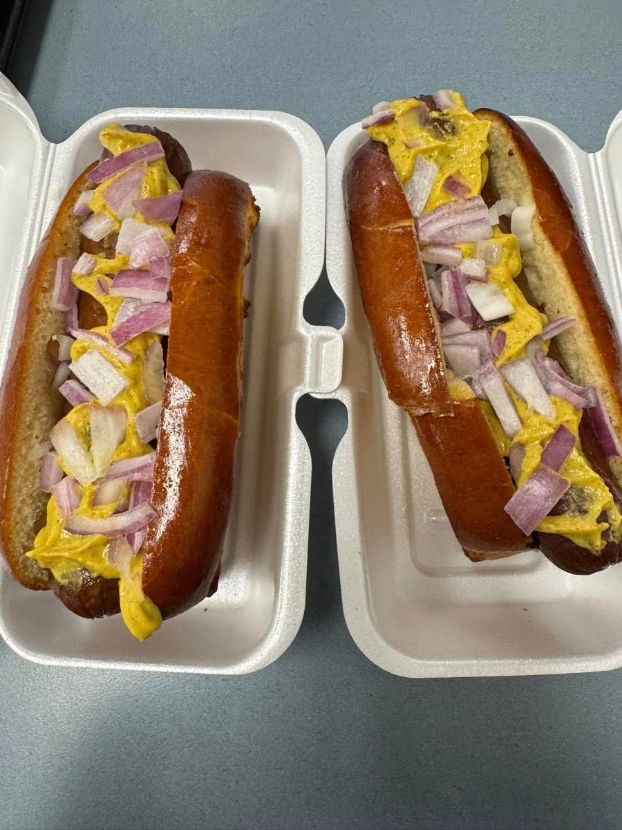 Hot dogs with mustard and onions