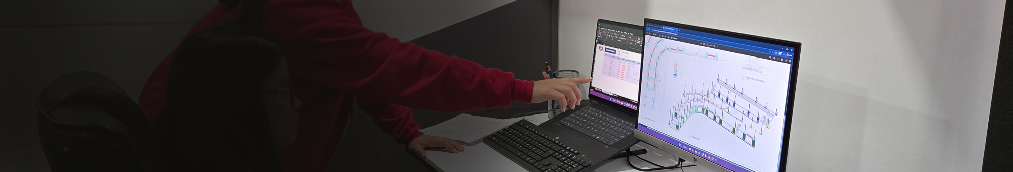 Engineers reviewing blueprints