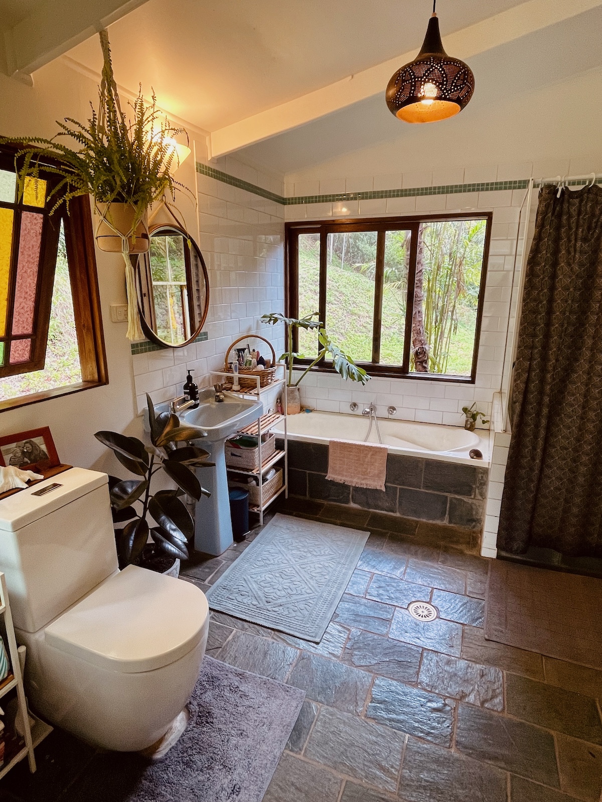 Bathroom with slate tiles, separate shower and bath
