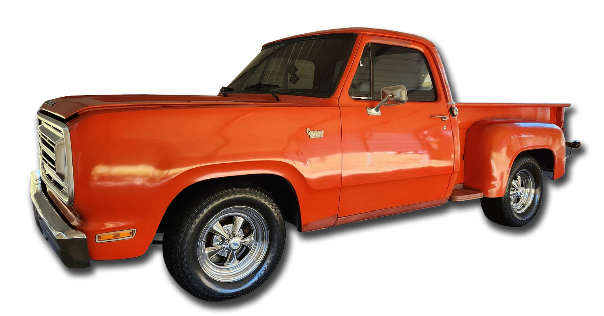 White GMC Denali truck with chrome wheels after professional detailing