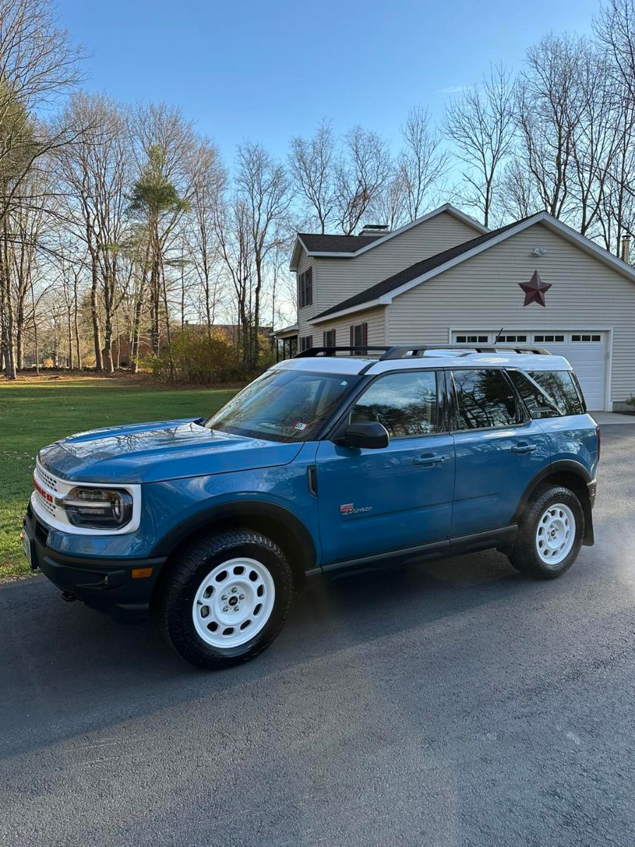 Blue Ford Bronco Sport with professional exterior detailing showing glossy paint finish