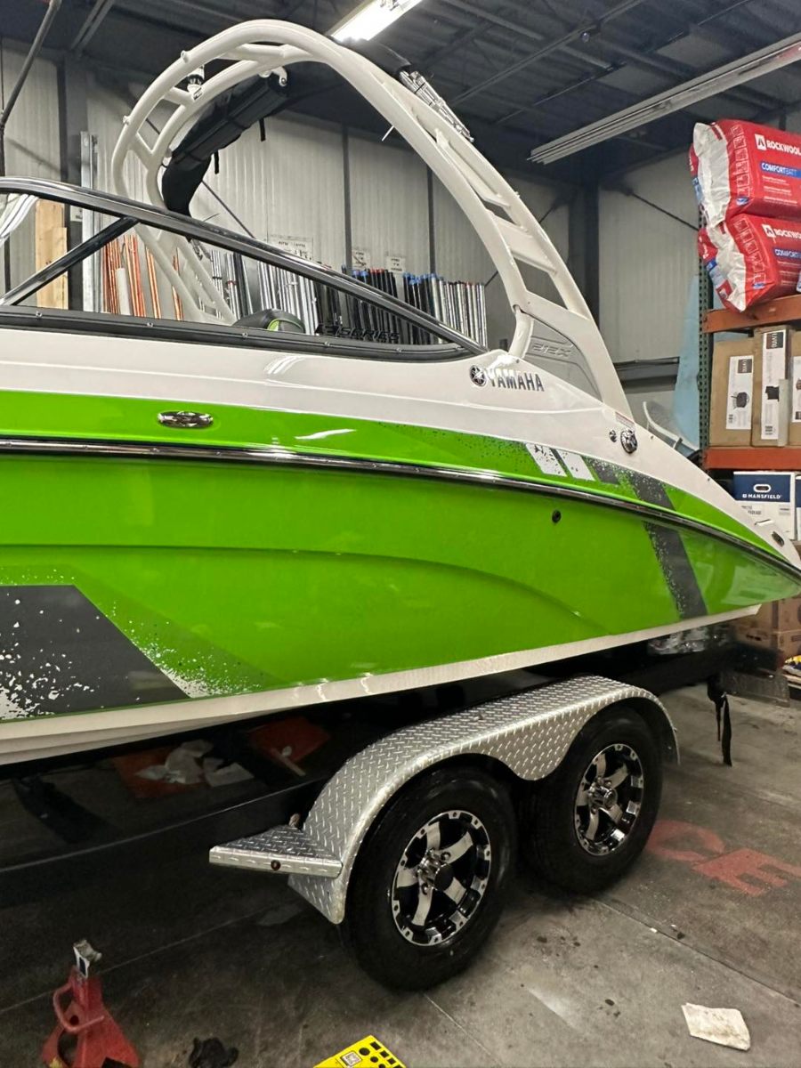 Green and white Yamaha boat with glossy ceramic coating finish