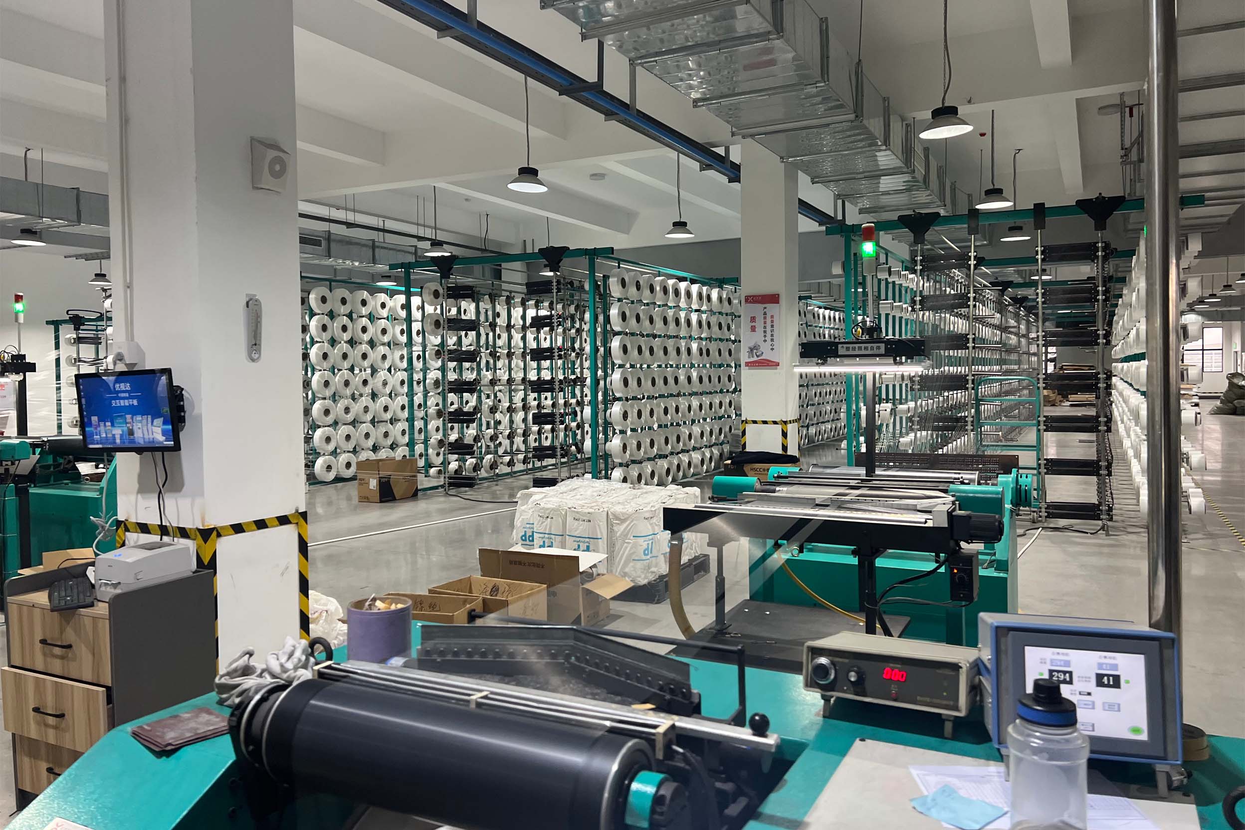 WellEmpire Automated CPAP Strap Production Line – Shenzhen Factory WellEmpire CPAP strap factory production line – workers operating industrial cutting machines in Shenzhen