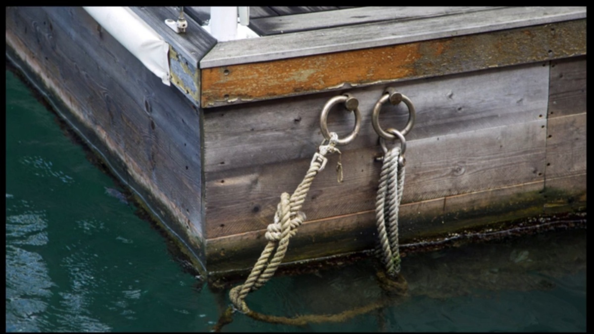 Boat tied to pier