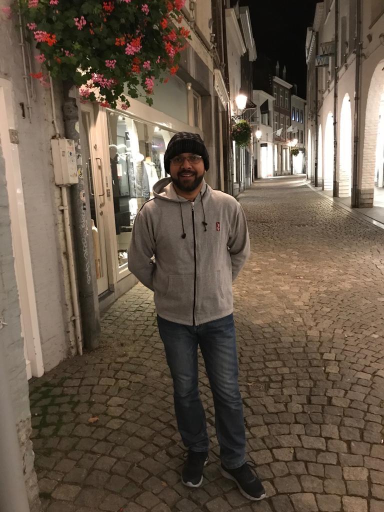 Reflective moment during an evening walk through historic streets