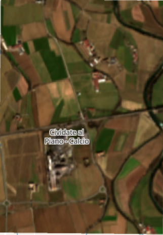 Cividate al Piano site before construction - aerial view showing agricultural land and rural setting