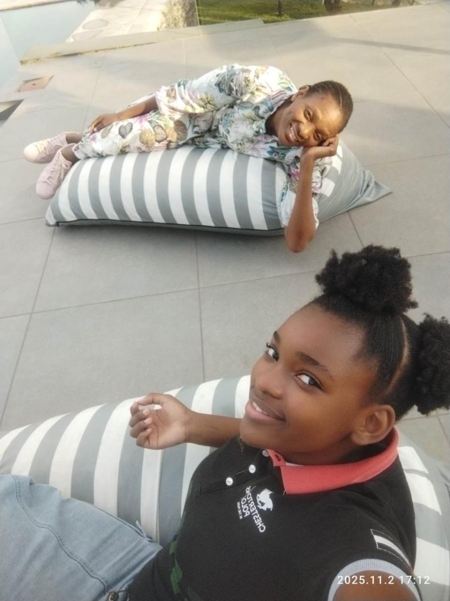 Two women relaxing on outdoor cushions at Arise & Shine Lifestyle Centre