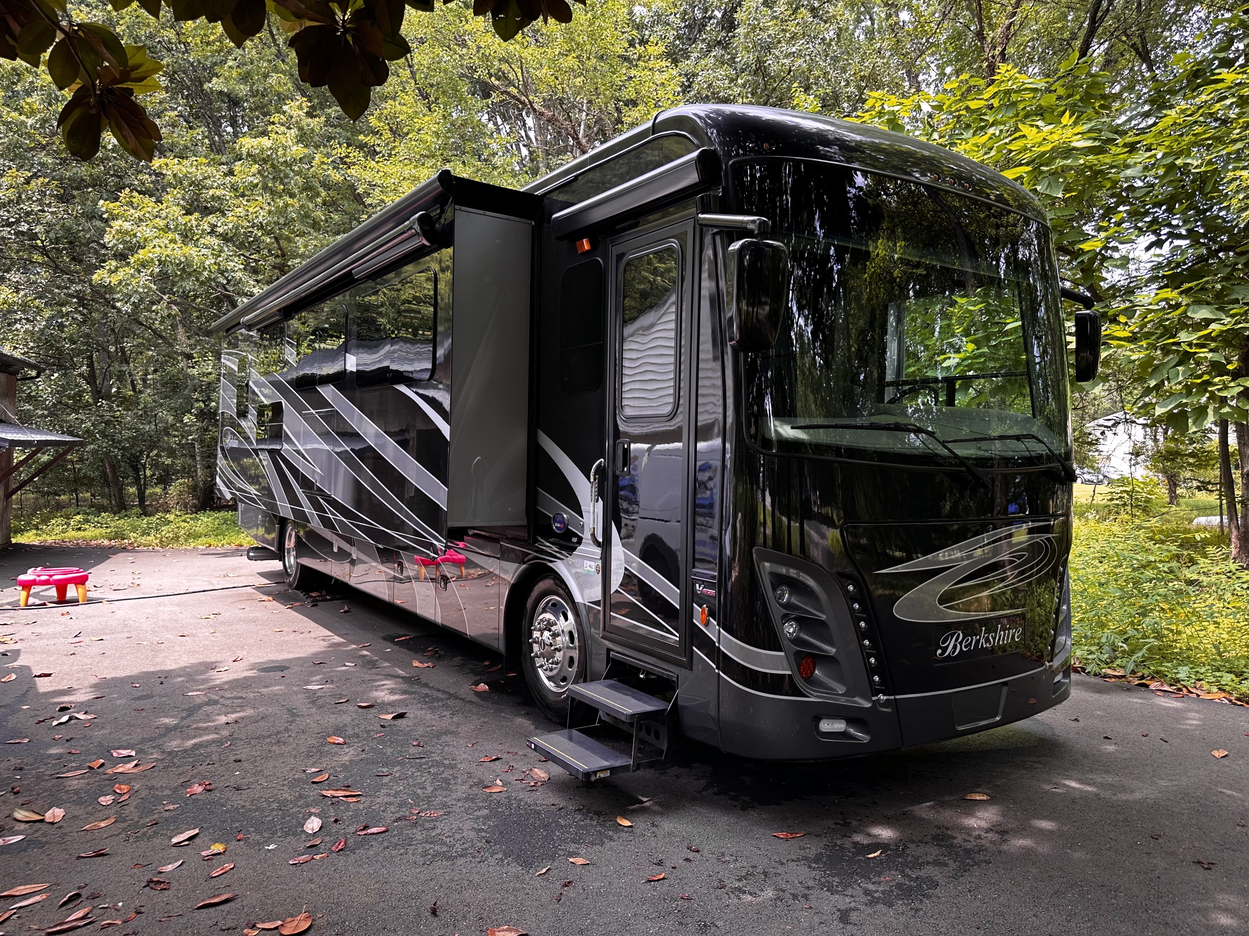 Large recreational vehicle receiving professional RV detailing service showing specialized care for motorhomes in Glen Burnie Maryland