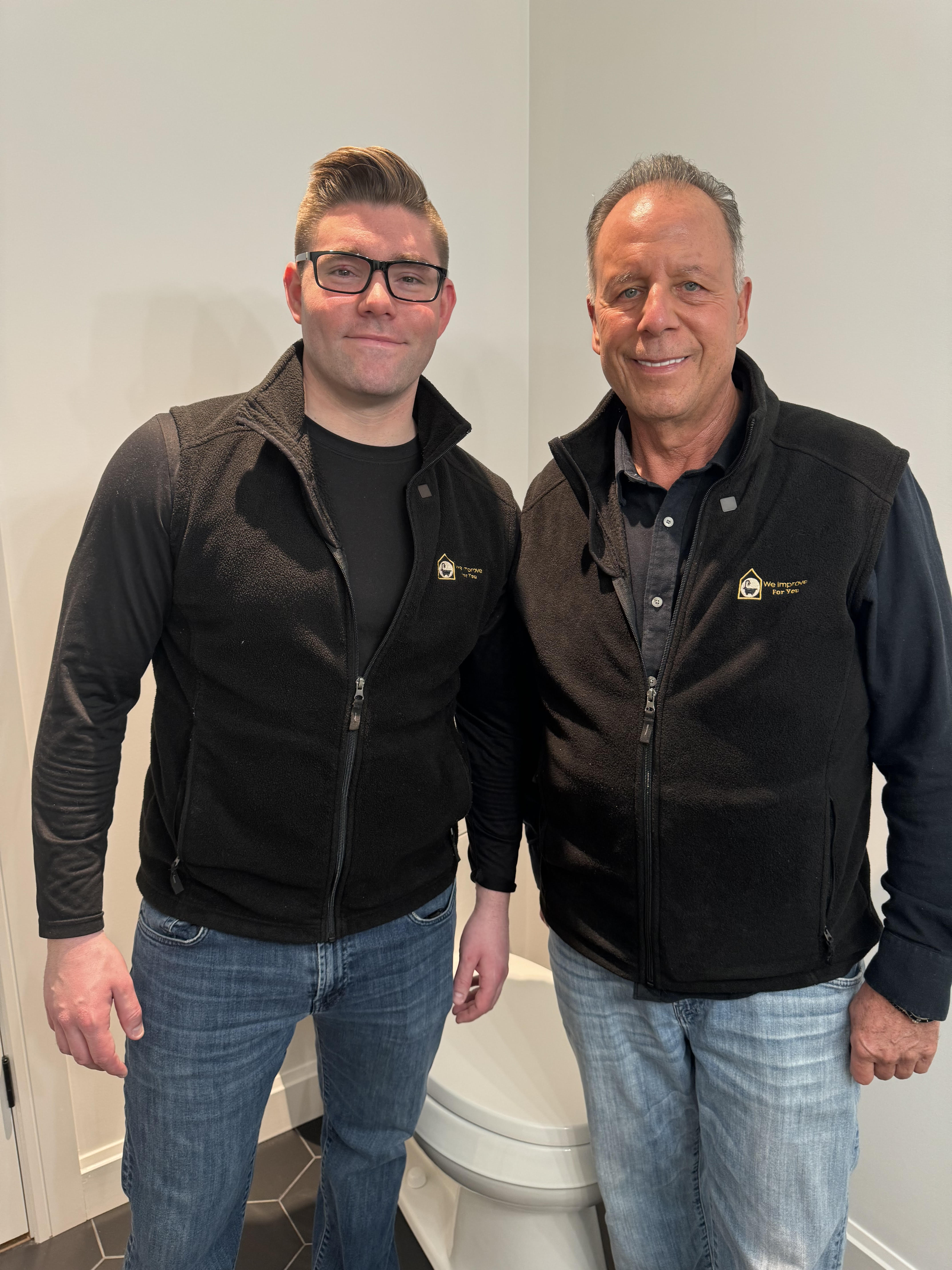 We Improve for You father and son team on a bathroom remodeling job site