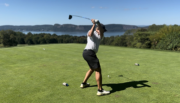 Golfers walking a lush fairway at a prestigious private golf club — Bucket List Golf community