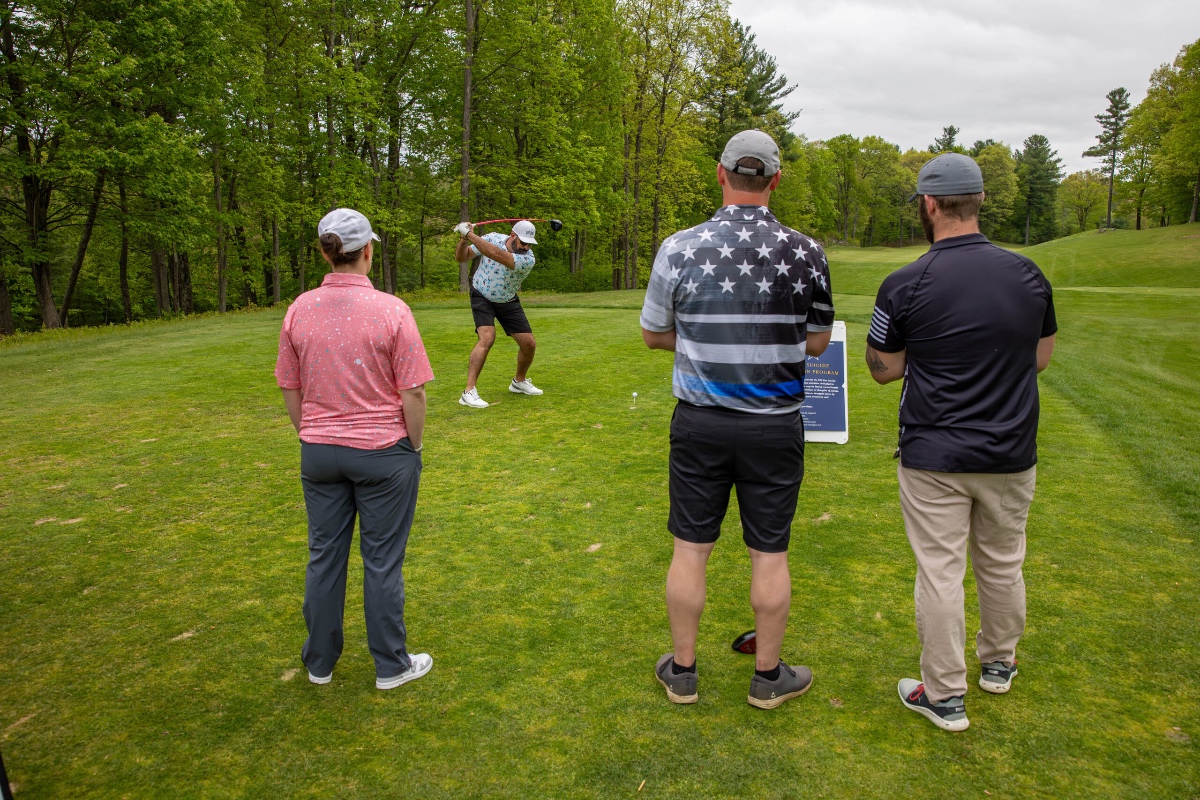 Golfers participating in charitable giving at Bucket List Golf events, showing how the community comes together to support veterans