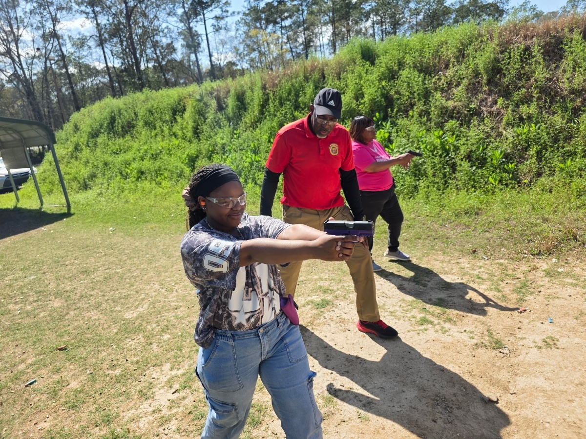 Student practicing proper shooting stance at the range