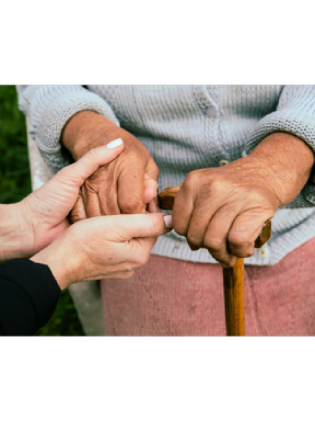 Professional healthcare worker providing compassionate care to elderly client in home setting