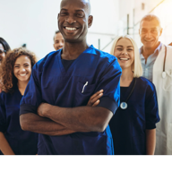 Professional healthcare team smiling together in medical facility
