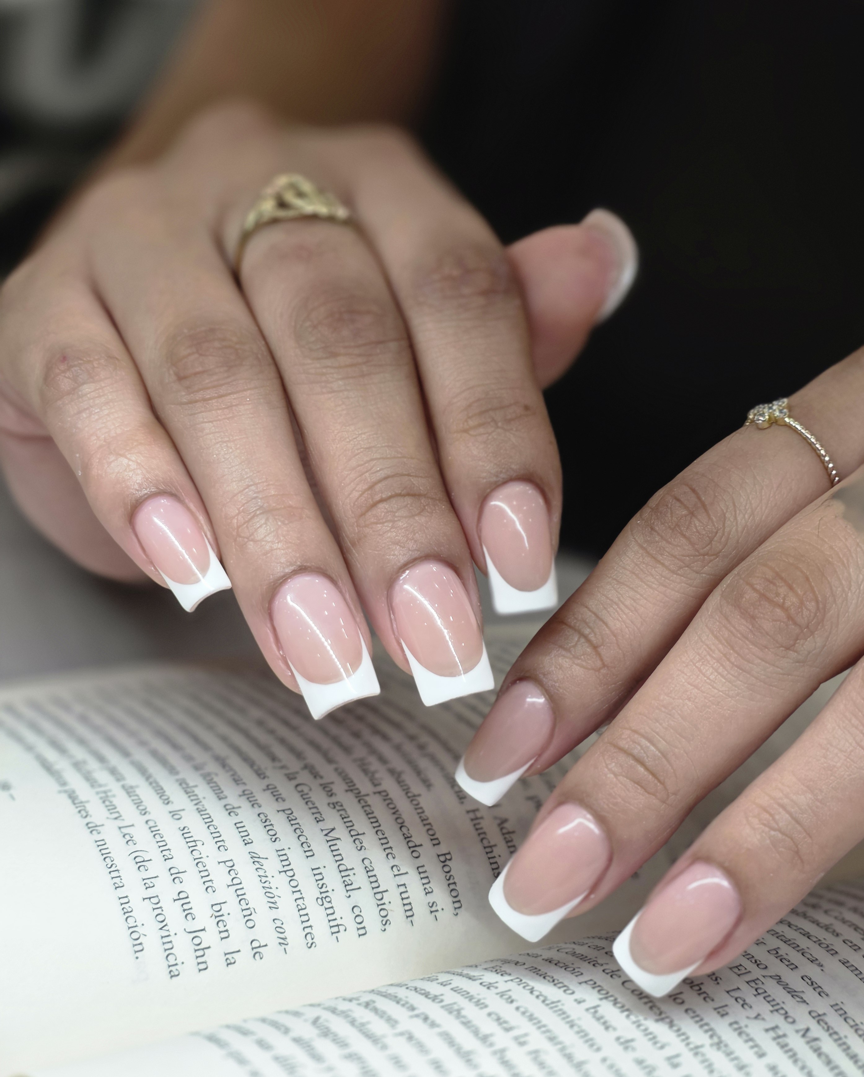 Vibrant nail art in bright orange tones with professional finish and elegant design showcasing bold color artistry