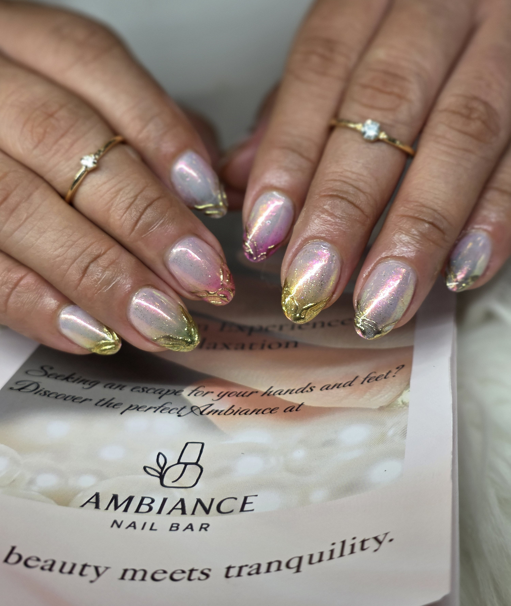 Creative nail art design featuring burgundy and pink polka dots with adorable character details and professional finish