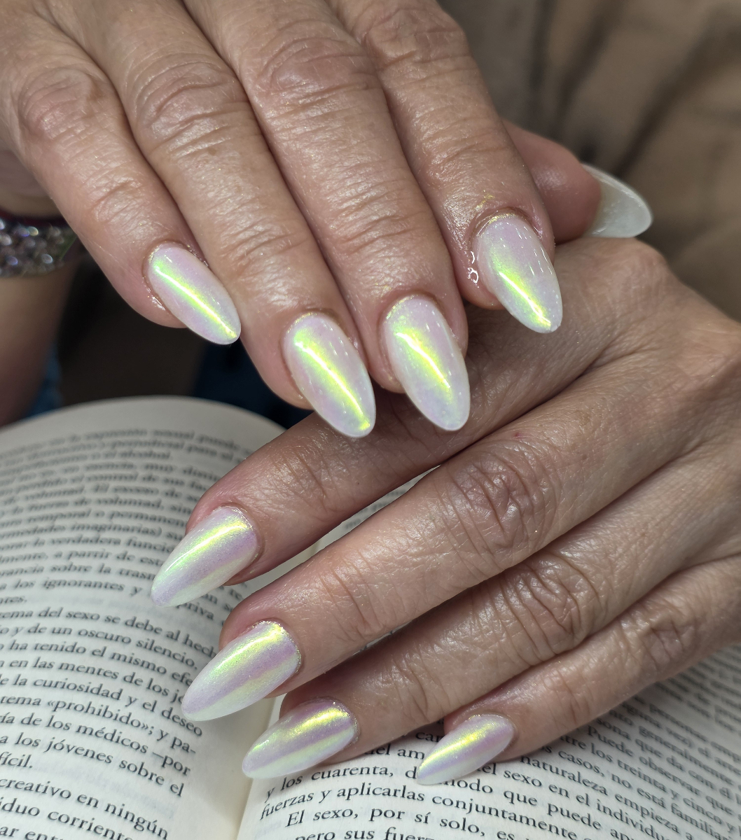 Stunning iridescent chrome nail art with aurora borealis effects, golden details and sophisticated design showcasing premium metallic techniques