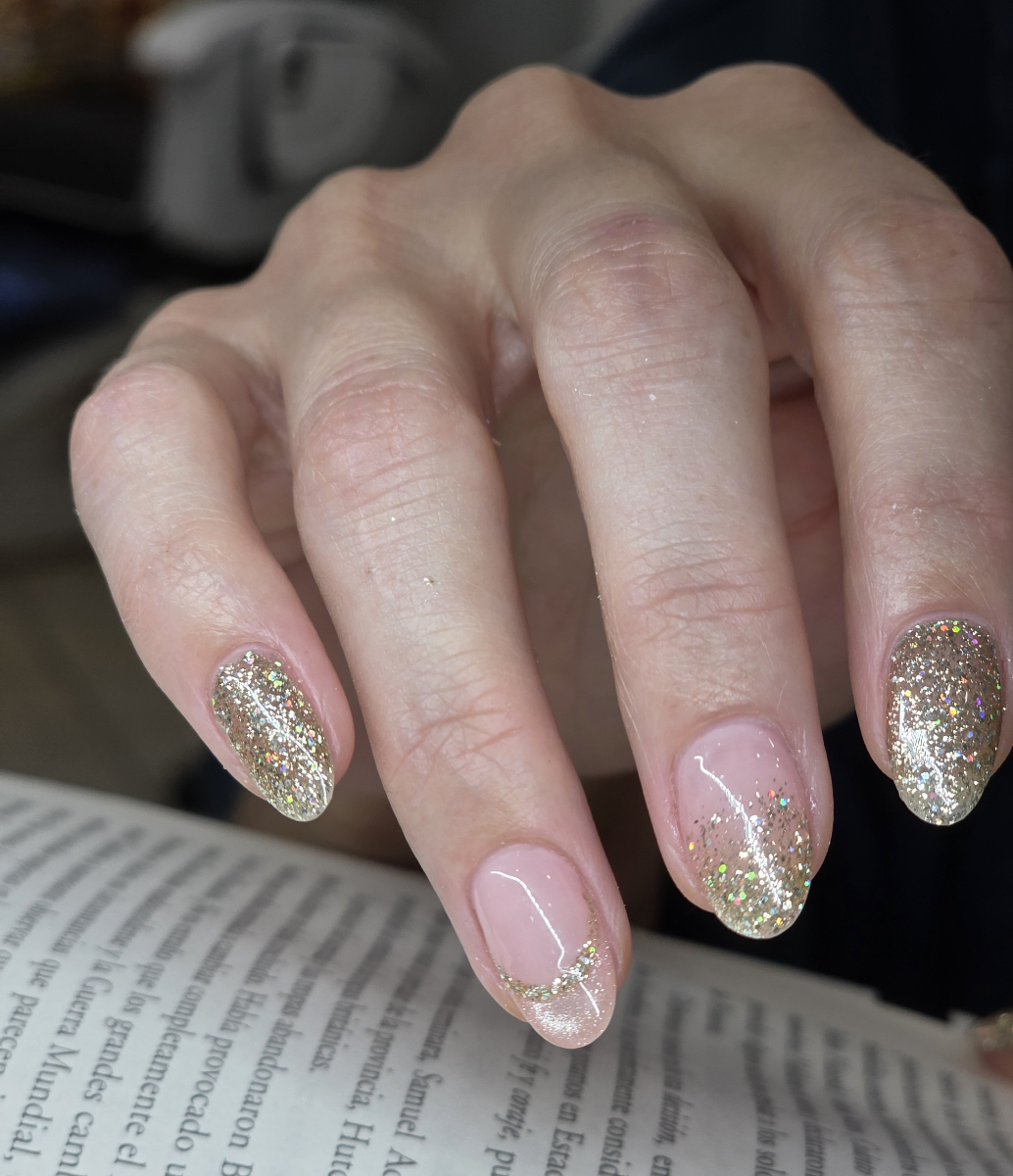 Spectacular nail art with brilliant golden metallic effects and elegant decorative details showcasing premium artistry and sophisticated finish