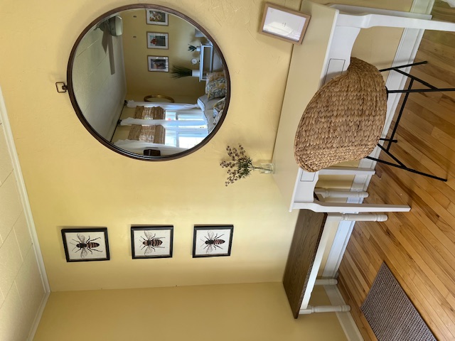 Entrance with Bee Artwork and Vanity