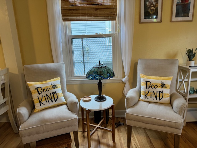 The Honey Bee living room with Bee Kind chairs