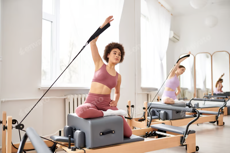 African American woman on Pilates reformer