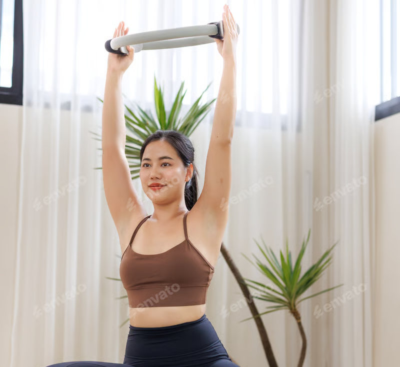 Latina woman on Pilates reformer