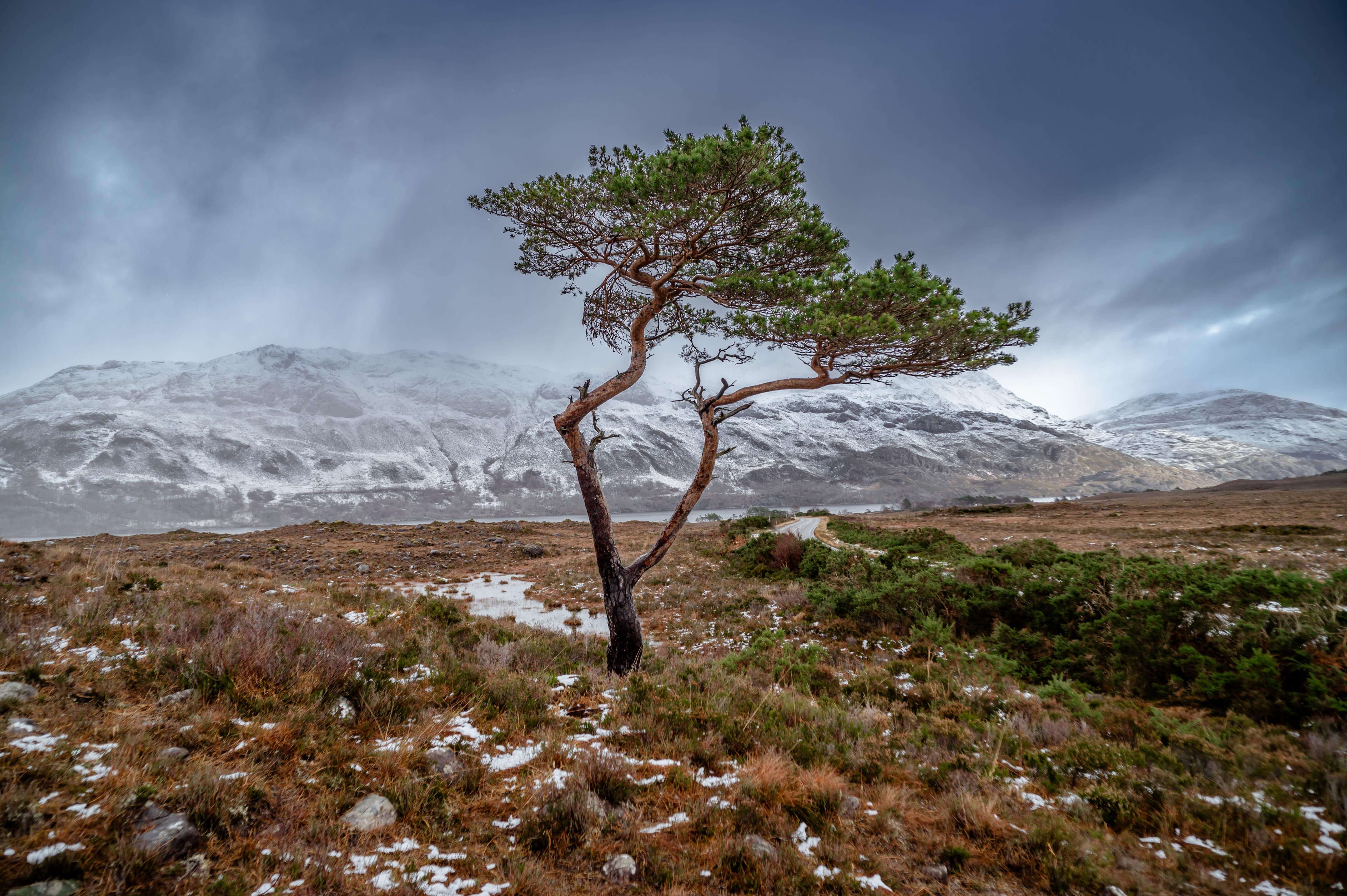 Scottish coastline seascape photography — dramatic stormy waves crashing against rugged cliffs