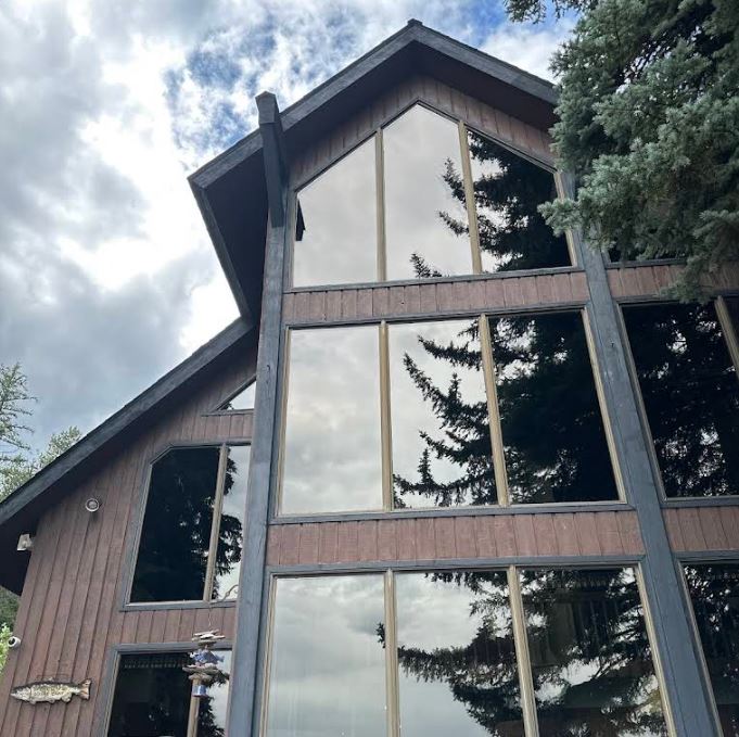 Professional window cleaning technician at work in Spokane WA