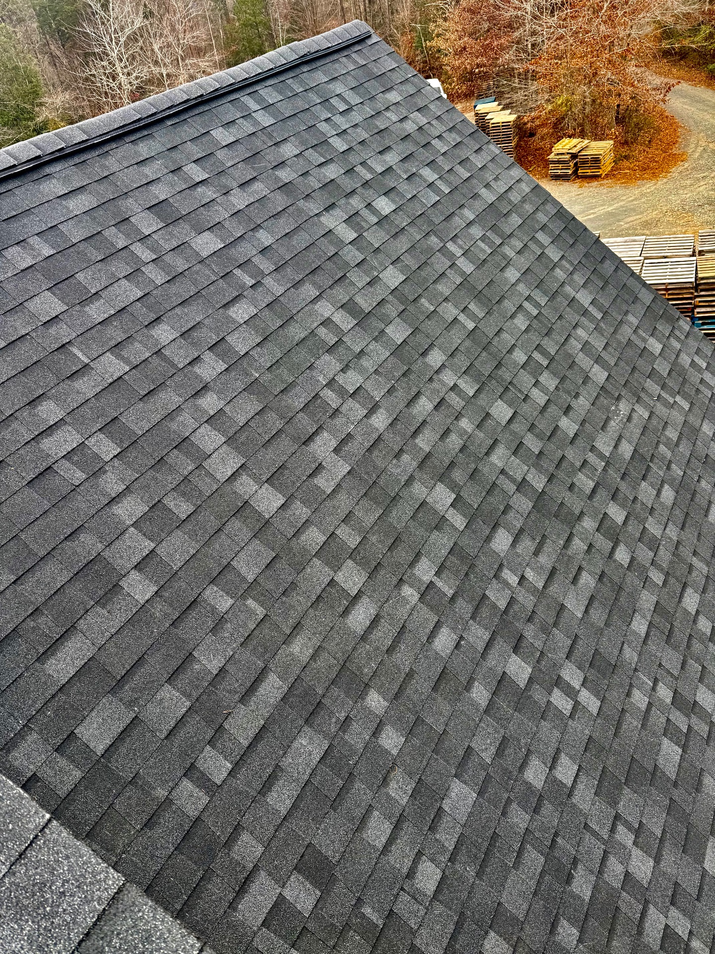 Newly installed asphalt shingle roof — aerial view
