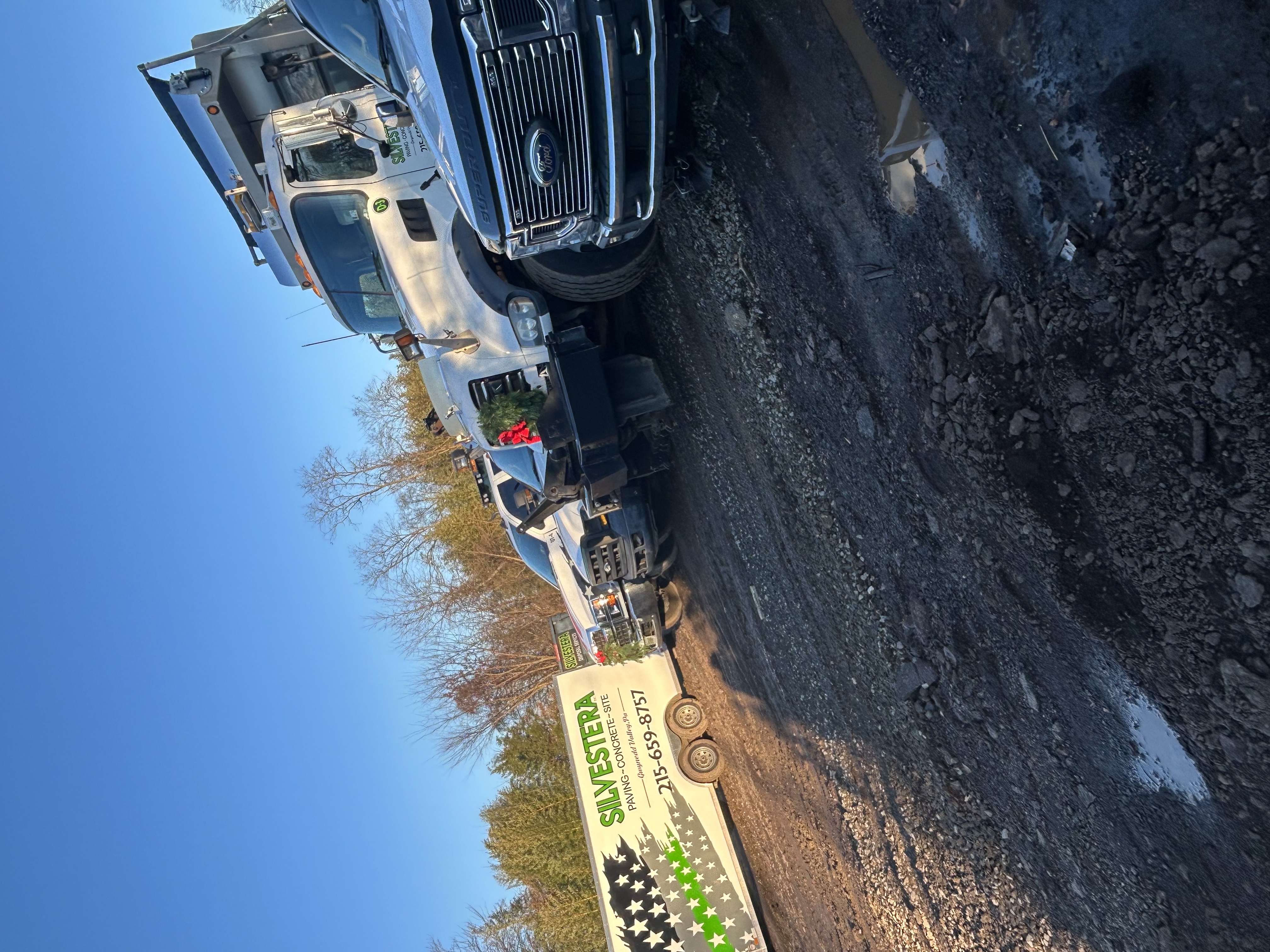 Commercial concrete sidewalk installation alongside asphalt roadway showing material comparison at a Pennsylvania commercial property