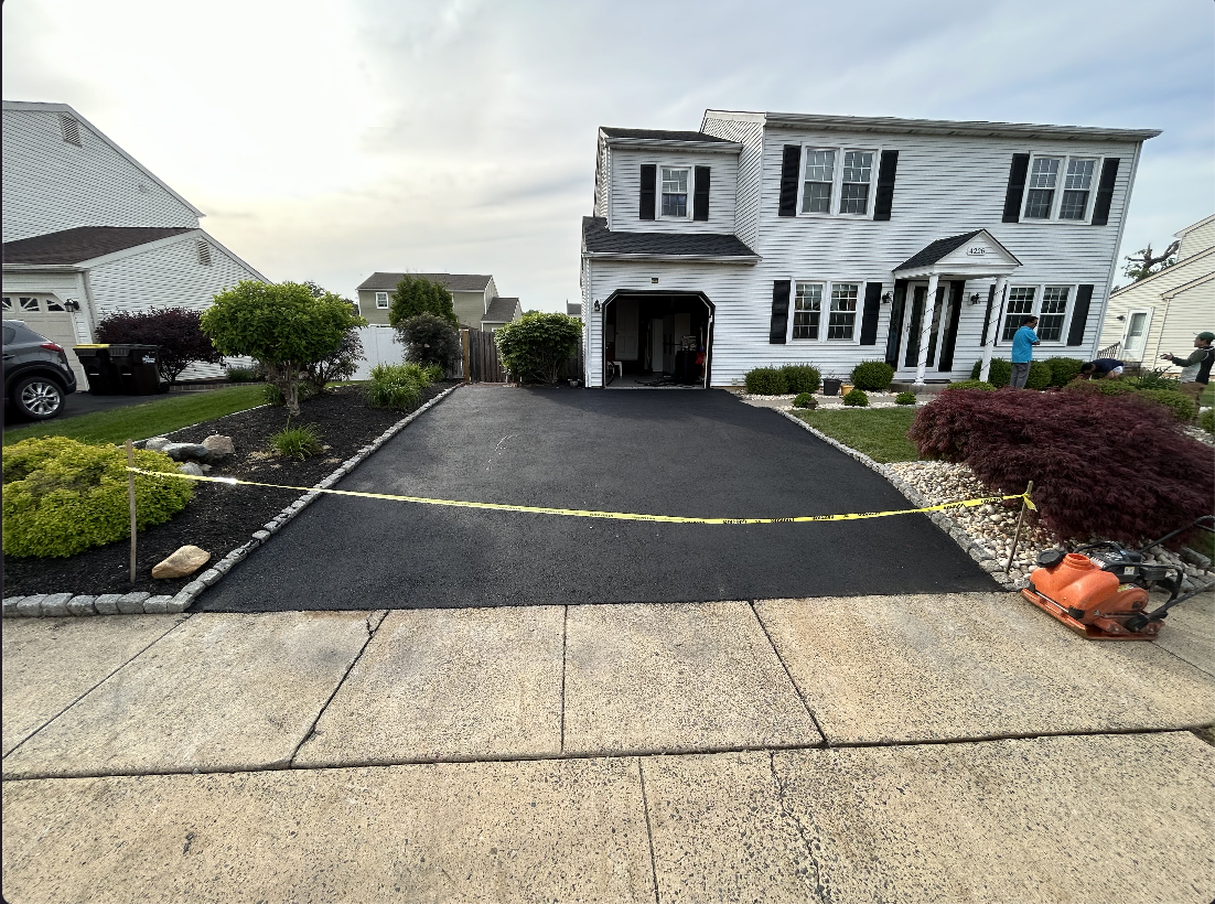 MT Paving & Concrete team at work on a residential driveway