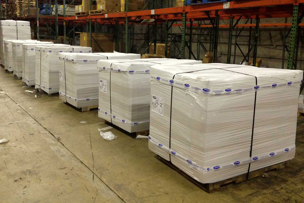 State-of-the-art warehouse facility with organized inventory management and professional staff coordinating international shipments