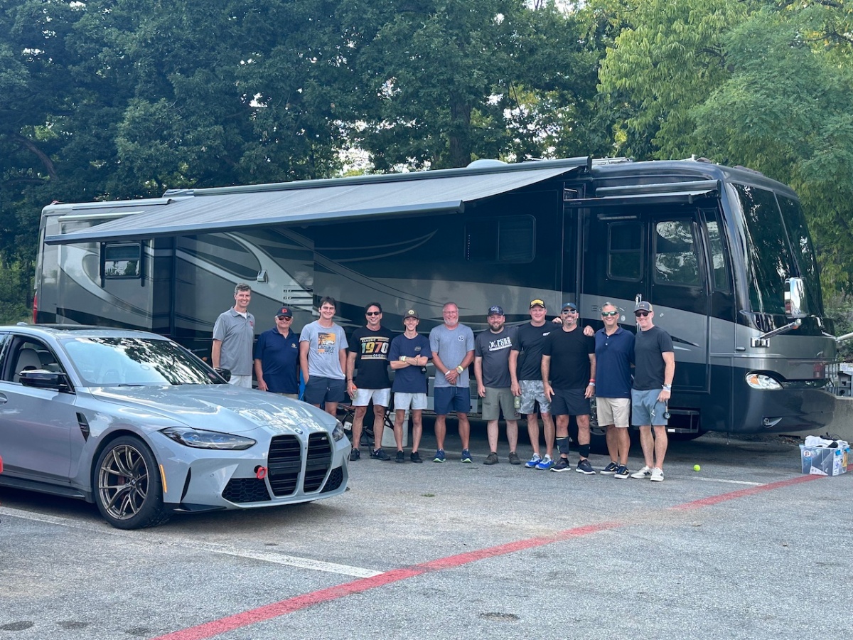 Victory 360 team group photo at race track