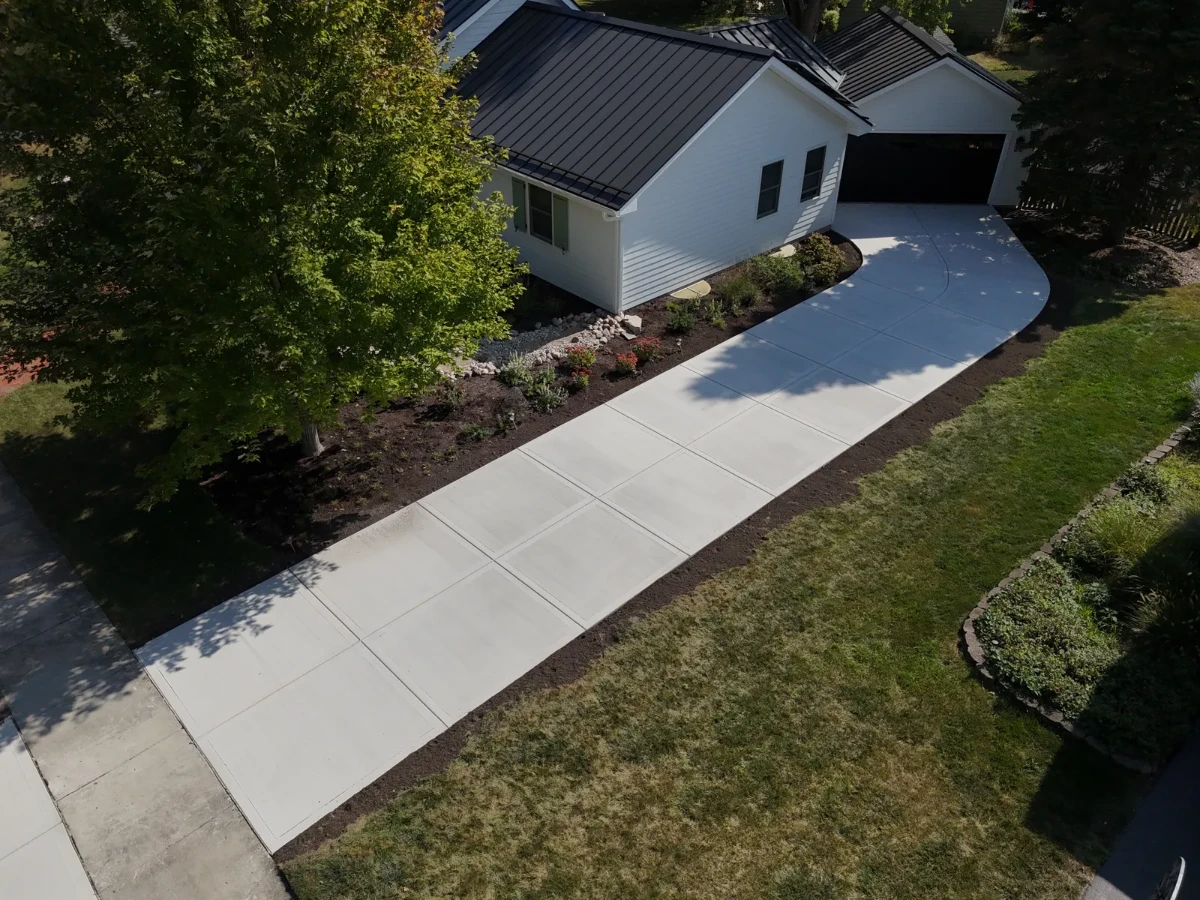Aerial view of curved concrete driveway installation in Bethlehem GA by Greenstone Landscaping