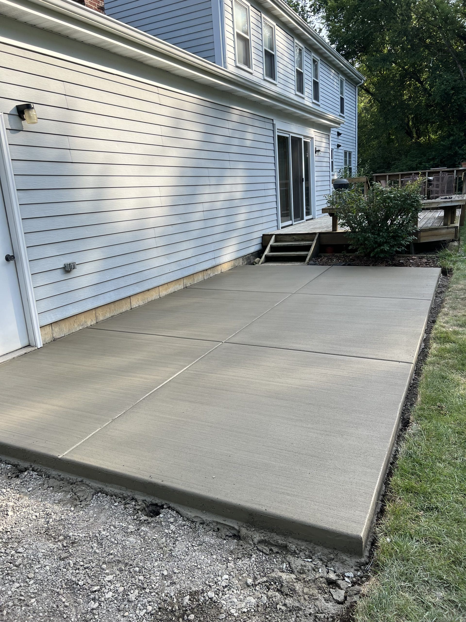 Concrete patio installation by Greenstone Landscaping in Walnut Grove GA