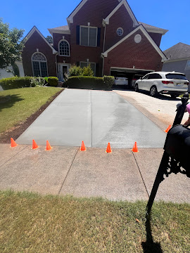 Freshly poured concrete driveway in Auburn GA by Greenstone Landscaping