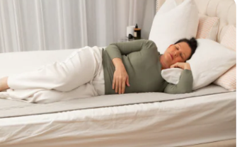 Woman resting comfortably on grounding mat