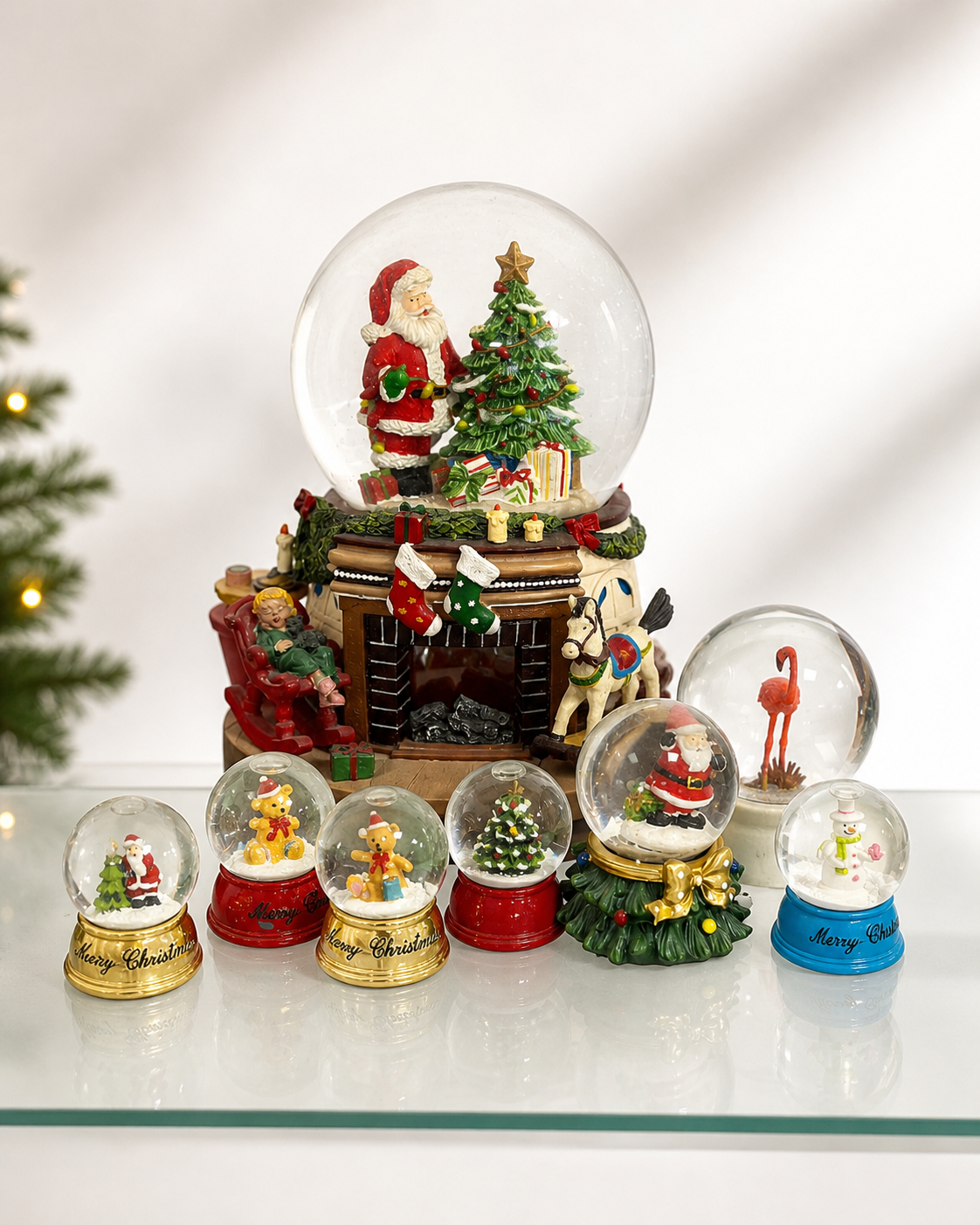 Custom snow globe with an LED base glowing warm light and a detailed miniature scene inside