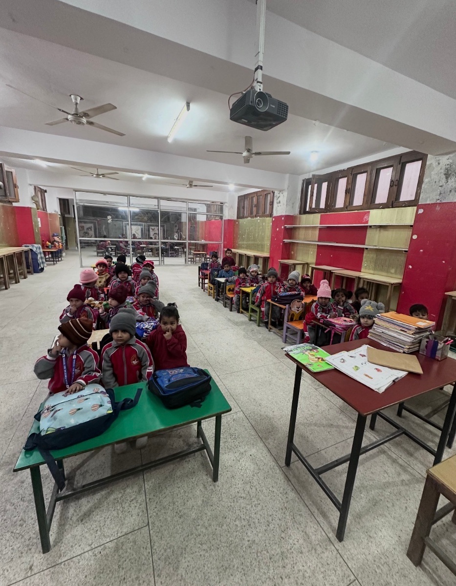 Young students in their classroom at Doon Public School wearing burgundy uniforms
