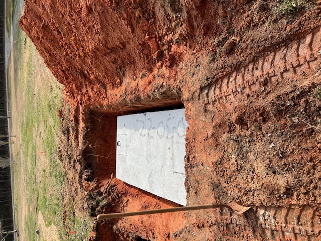 Freshly installed concrete septic tank set in an excavated pit in Rock Hill SC — DLC Septic & Lawn Services installation