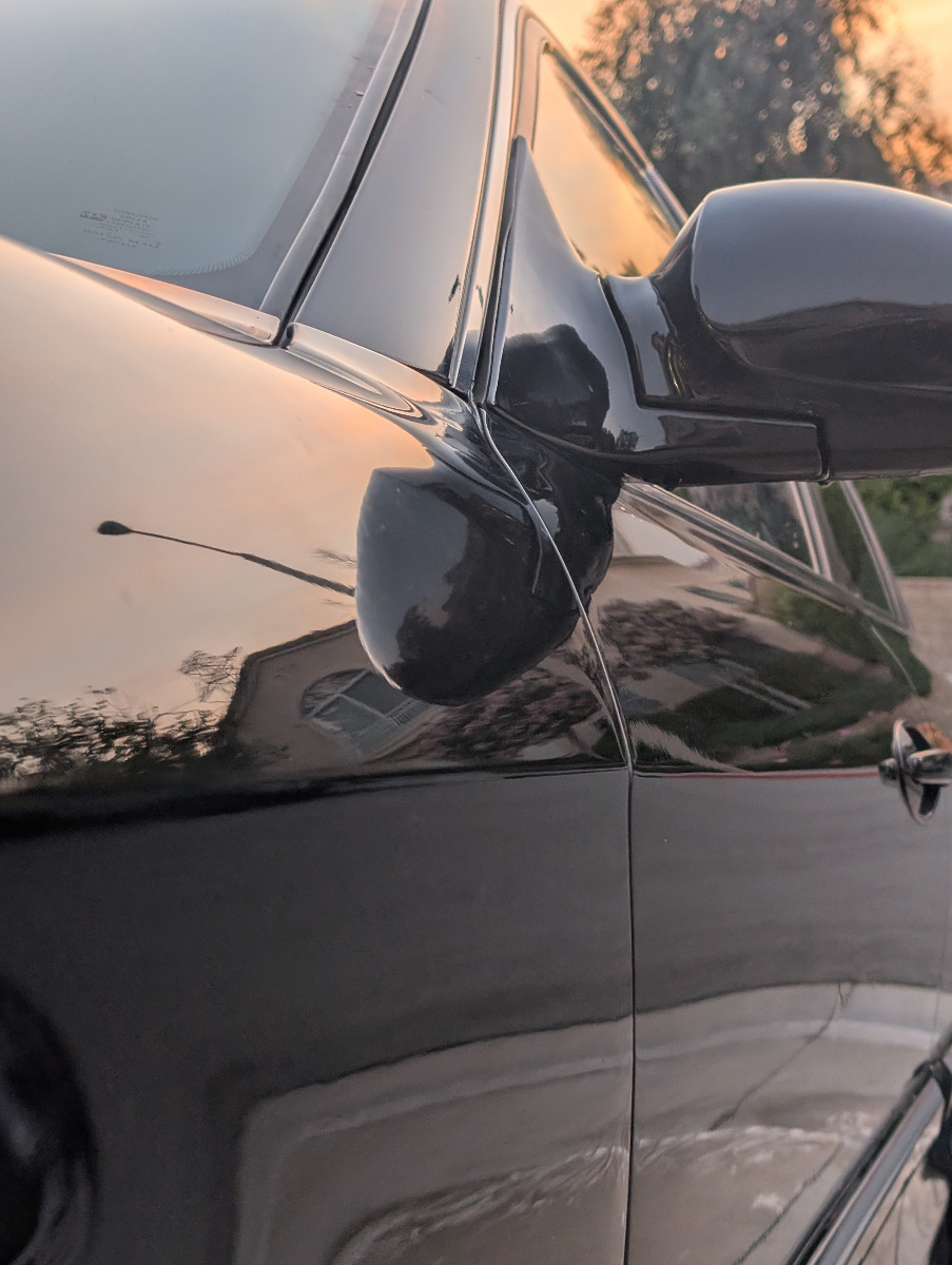 Professional exterior detailing of silver Hyundai Sonata showcasing mirror-like paint finish and pristine body work with excellent reflectivity